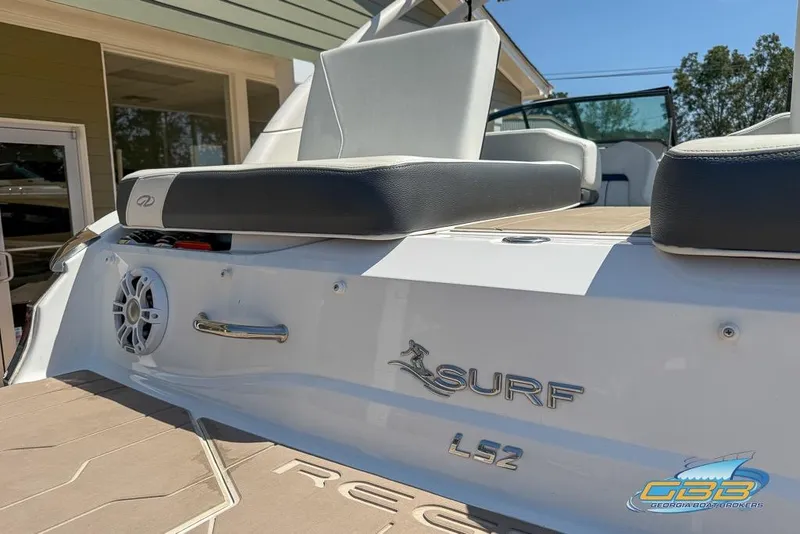 Slide: The Image of 2022 Regal LS2 Surf boat rear view with seating and speaker details. - 30