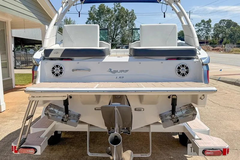 Slide: The Image of 2022 Regal LS2 Surf boat rear view with swim platform and speakers. - 31