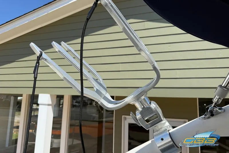 Slide: The Image of Wakeboard rack on a 2022 Regal LS2 Surf boat, mounted on a sunny day. - 33