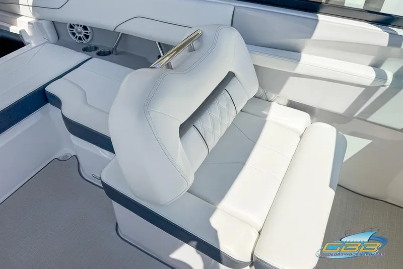 Slide: The Image of Luxurious seating on 2022 Regal LS2 Surf boat, featuring white upholstery and modern design. - 35