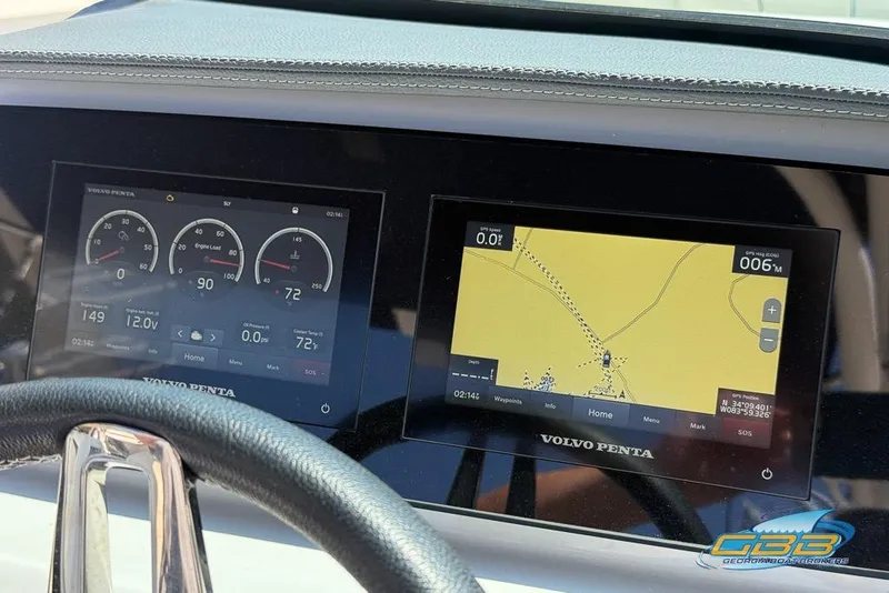 Slide: The Image of Dashboard of 2022 Regal LS2 Surf boat with Volvo Penta displays showing navigation and engine data. - 37