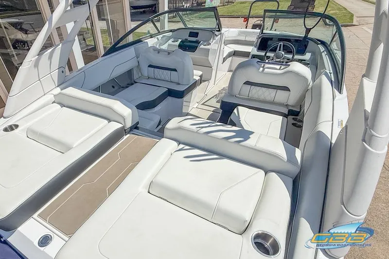 Slide: The Image of 2022 Regal LS2 Surf boat interior with luxurious white seating and modern dashboard. - 39
