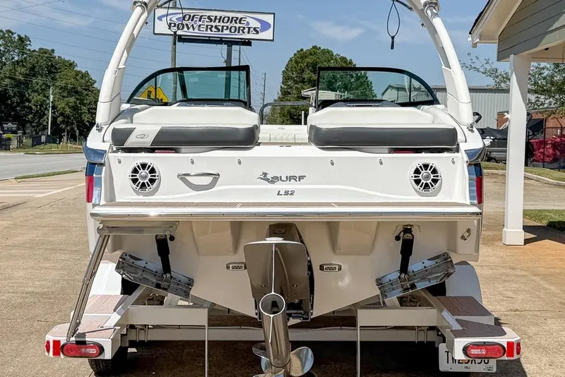 Slide: The Image of 2022 Regal LS2 Surf boat displayed at Offshore Powersports dealership. - 4
