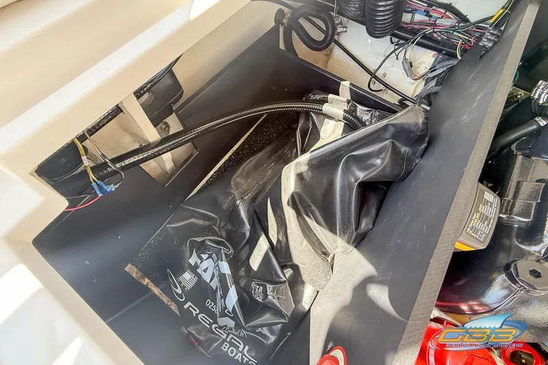 Slide: The Image of Interior view of 2022 Regal LS2 Surf boat showing wiring and components. - 45