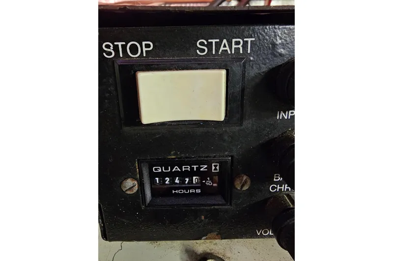 Slide: The Image of Control panel of 1982 Chris-Craft 410 Motor Yacht showing 1247 hours. - 22