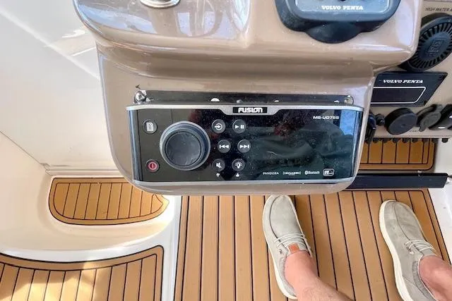 Slide: The Image of Control panel of a 2005 Regal Commodore 4260 boat with Fusion audio system. - 24