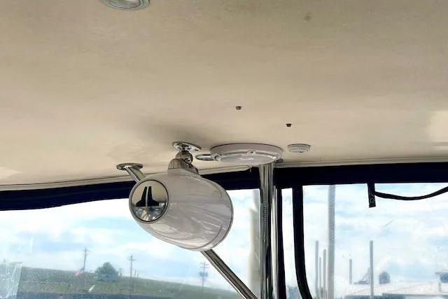 Slide: The Image of Ceiling view of 2005 Regal Commodore 4260 boat with mounted speaker and window. - 30