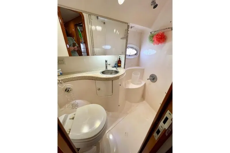 Slide: The Image of Luxurious bathroom in 2005 Regal Commodore 4260 yacht with modern amenities. - 40