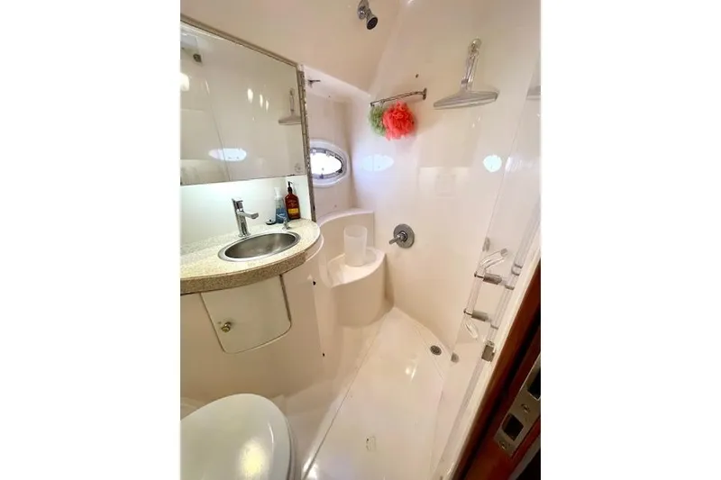 Slide: The Image of Bathroom interior of 2005 Regal Commodore 4260 yacht, featuring sink and shower. - 41