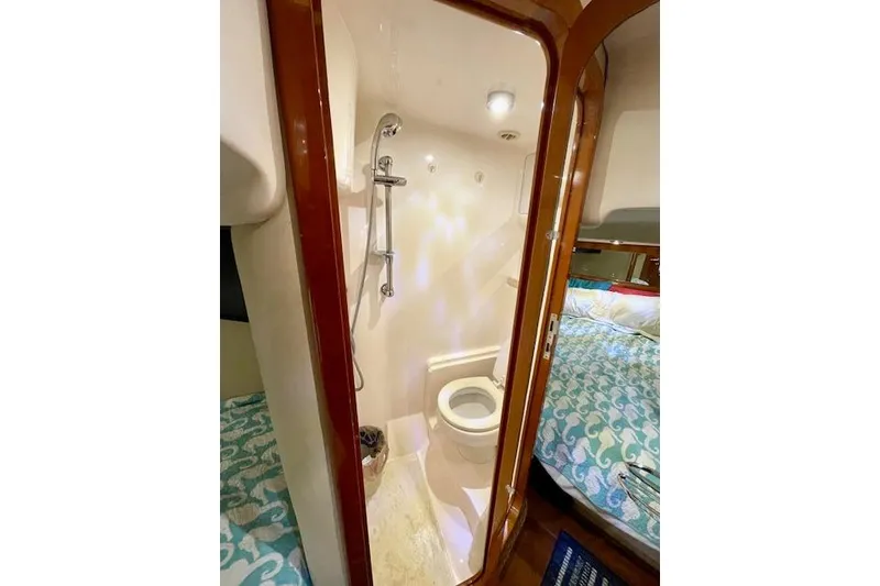 Slide: The Image of 2005 Regal Commodore 4260 yacht bathroom with shower and toilet. - 46