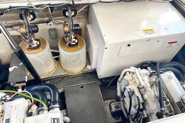 Slide: The Image of Engine room of 2005 Regal Commodore 4260 yacht, showcasing mechanical components and systems. - 50