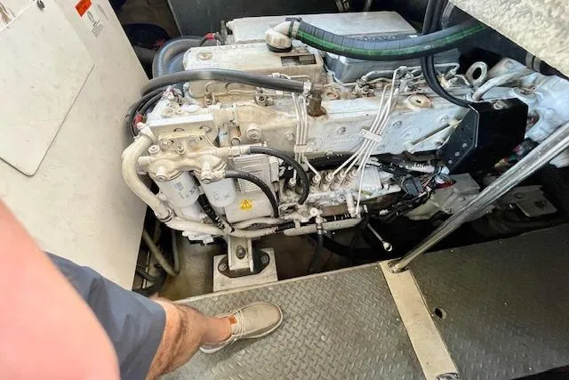 Slide: The Image of Engine compartment of a 2005 Regal Commodore 4260 boat, showing detailed machinery. - 53