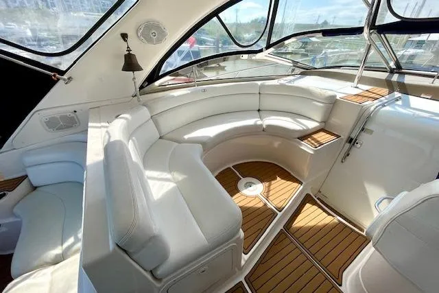 Slide: The Image of Luxurious 2005 Regal Commodore 4260 yacht interior with white leather seating and wood flooring. - 7