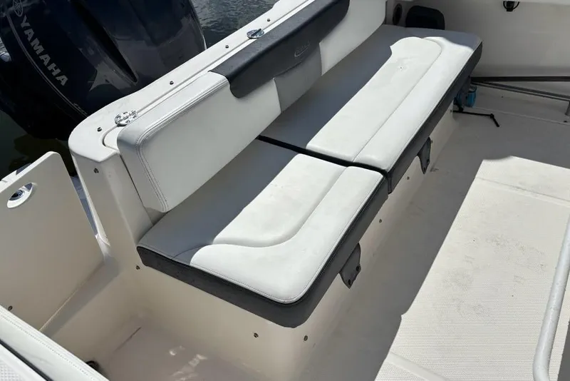 Slide: The Image of 2020 Robalo R222 Center Console boat with cushioned seating and Yamaha engine. - 13