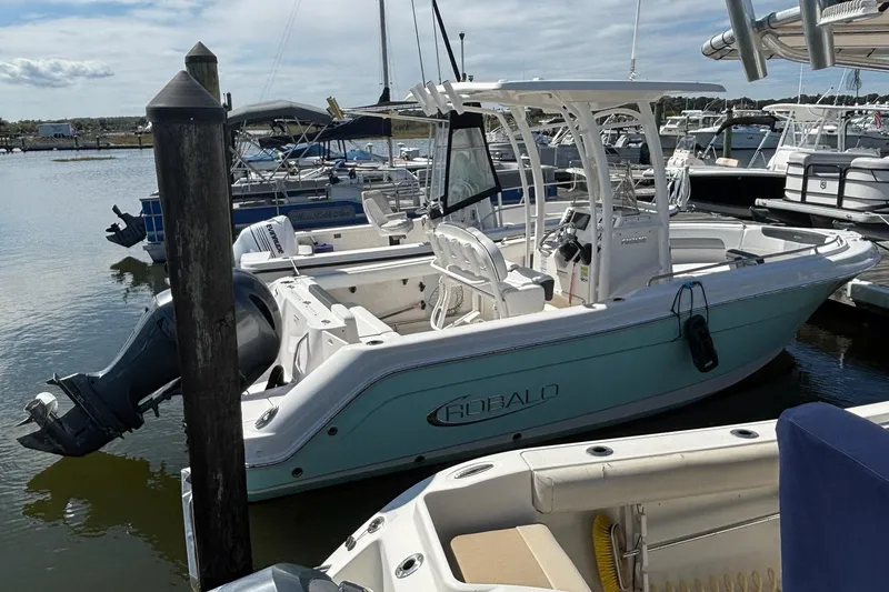 Slide: The Image of 2020 Robalo R222 Center Console boat docked in a marina. - 14