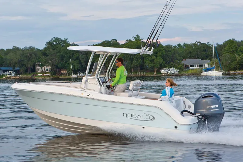 Slide: The Image of Manufacturer Provided Image: 2020 Robalo R222 Center Console boat cruising on a lake with two passengers. - 18