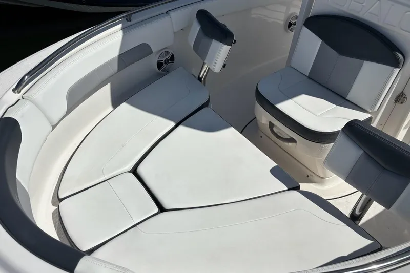 Slide: The Image of 2020 Robalo R222 Center Console boat interior with cushioned seating. - 6