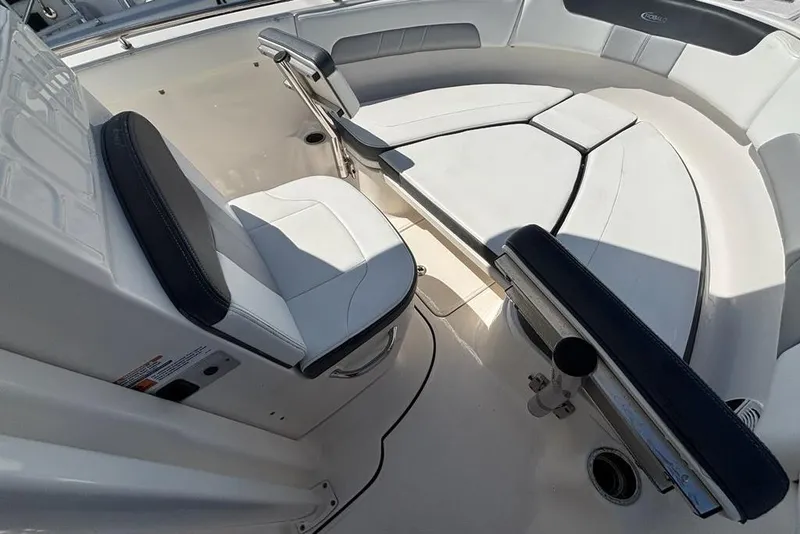 Slide: The Image of 2020 Robalo R222 Center Console boat interior with cushioned seating and sleek design. - 7