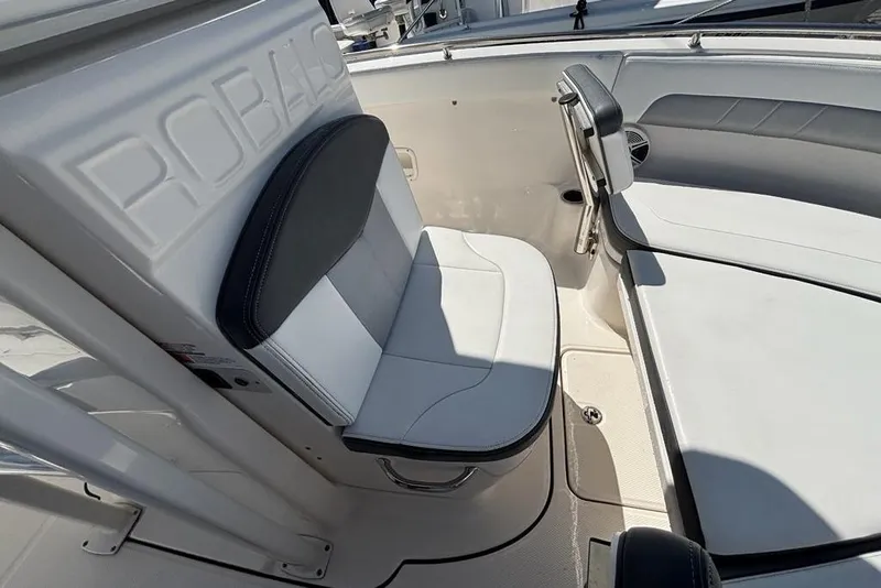 Slide: The Image of 2020 Robalo R222 Center Console boat interior with cushioned seating. - 8