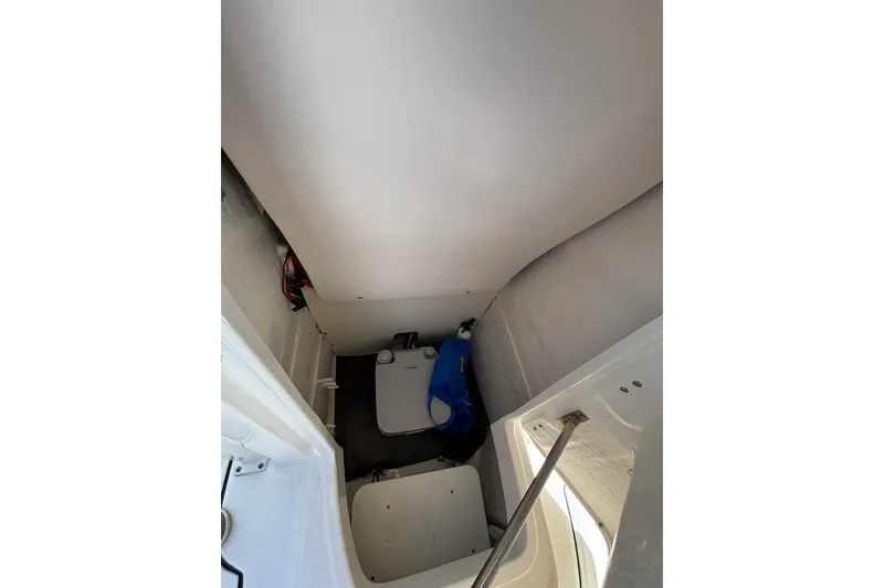 Slide: The Image of 2020 Robalo R222 Center Console interior storage compartment with equipment. - 9