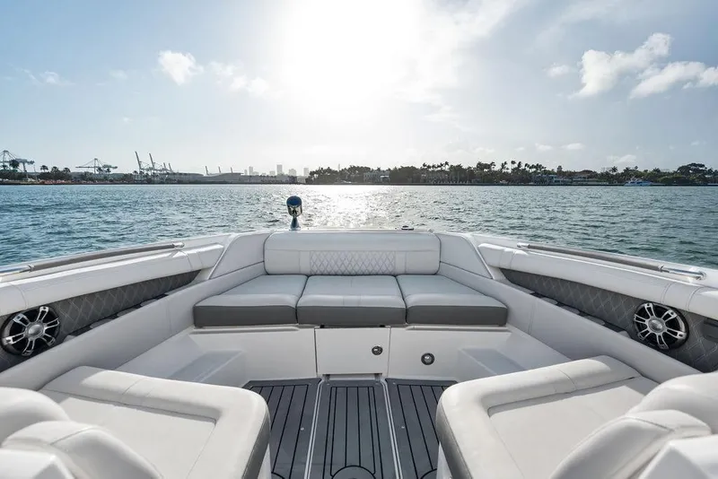 Slide: The Image of 2021 Sea Ray 350 SLX OB boat interior with waterfront view, sunny day. - 12
