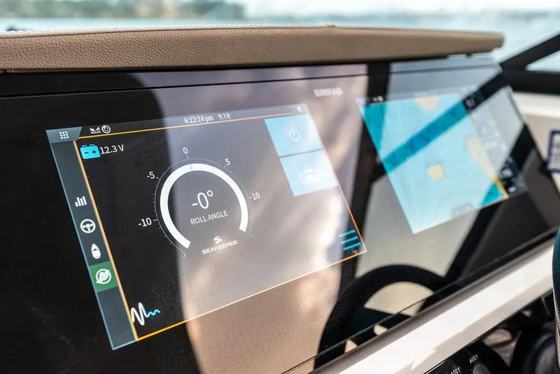 Slide: The Image of Dashboard of 2021 Sea Ray 350 SLX OB boat with digital display and controls. - 17
