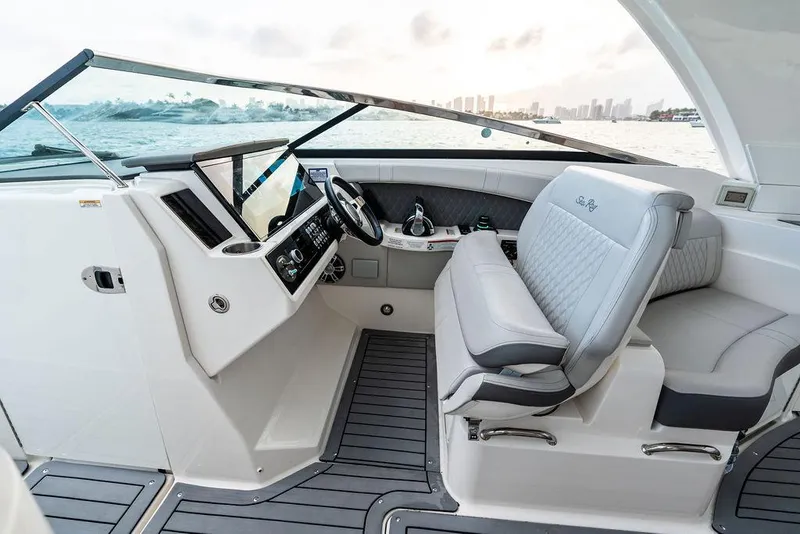 Slide: The Image of 2021 Sea Ray 350 SLX OB boat interior with modern helm and seating. - 19