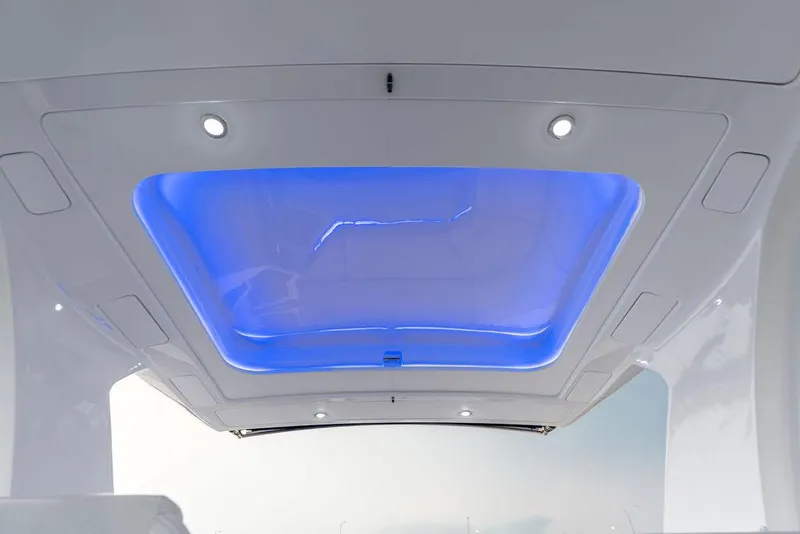 Slide: The Image of 2021 Sea Ray 350 SLX OB boat with illuminated blue LED ceiling. - 22