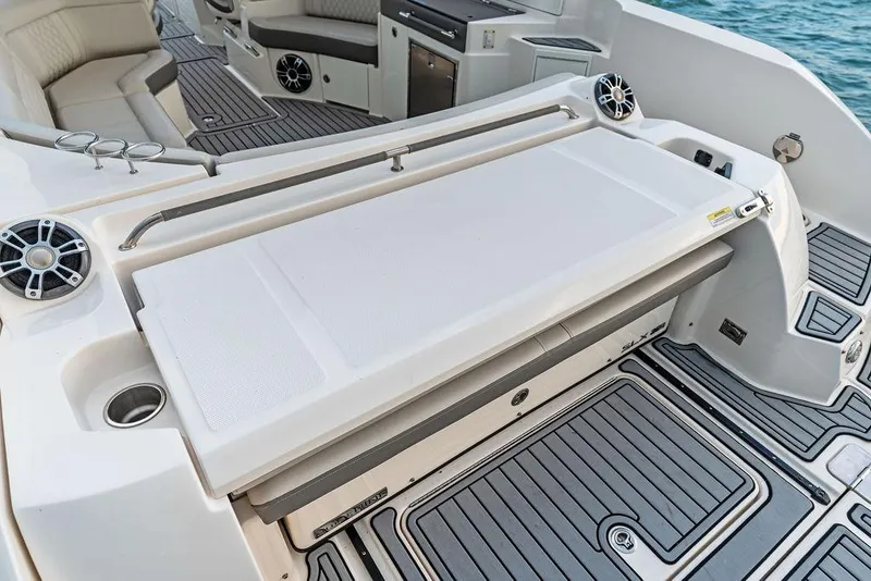 Slide: The Image of 2021 Sea Ray 350 SLX OB boat interior with seating and deck details. - 28