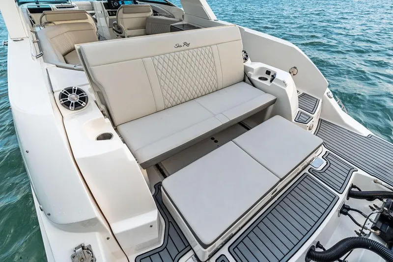 Slide: The Image of 2021 Sea Ray 350 SLX OB boat with luxurious seating on calm water. - 29