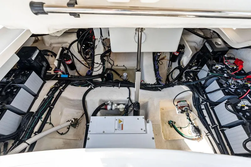 Slide: The Image of Engine compartment of a 2021 Sea Ray 350 SLX OB, showcasing wiring and components. - 30