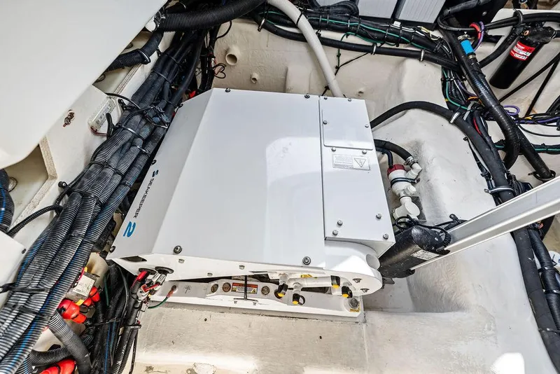 Slide: The Image of Engine compartment of 2021 Sea Ray 350 SLX OB with visible wiring and components. - 31