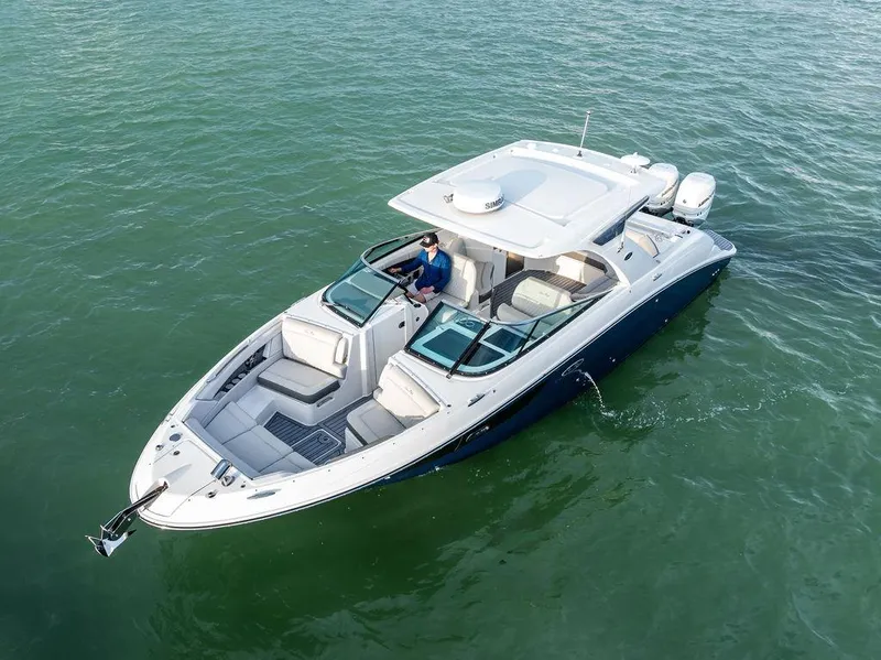 Slide: The Image of 2021 Sea Ray 350 SLX OB luxury boat cruising on calm waters. - 37