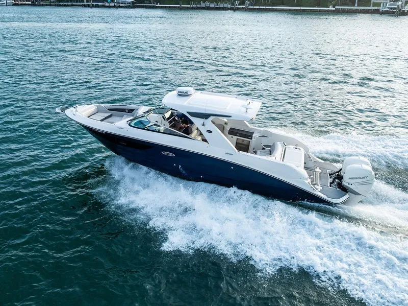 Slide: The Image of 2021 Sea Ray 350 SLX OB cruising on open water, showcasing sleek design and powerful performance. - 4