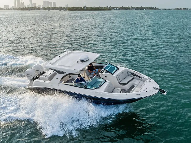 Slide: The Image of 2021 Sea Ray 350 SLX OB cruising on open water, showcasing sleek design and powerful performance. - 6