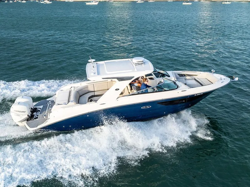 Slide: The Image of 2021 Sea Ray 350 SLX OB cruising on open water, showcasing sleek design and powerful performance. - 9