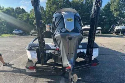 Slide: The Image of 2026 Skeeter ZXE21 boat with powerful outboard motor in a sunny outdoor setting. - 3