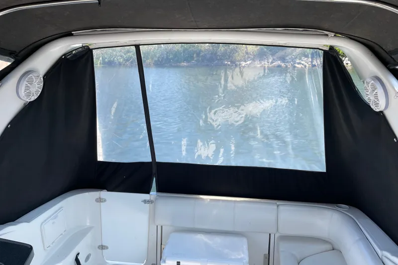 Slide: The Image of Interior view of 2003 Regal Commodore 3060 boat with water backdrop. - 14