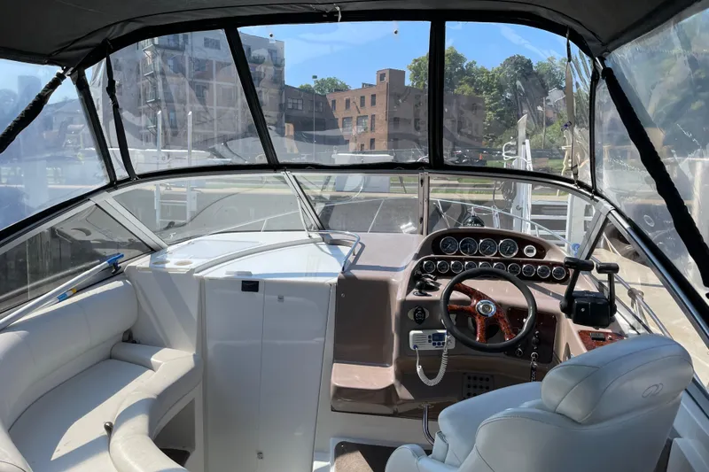 Slide: The Image of Interior view of 2003 Regal Commodore 3060 boat cockpit with steering wheel and dashboard. - 8