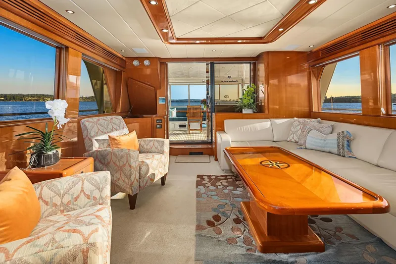Slide: The Image of Luxurious interior of 2014 Hampton 720 Skylounge LRC yacht with wood finishes and TV display. - 10