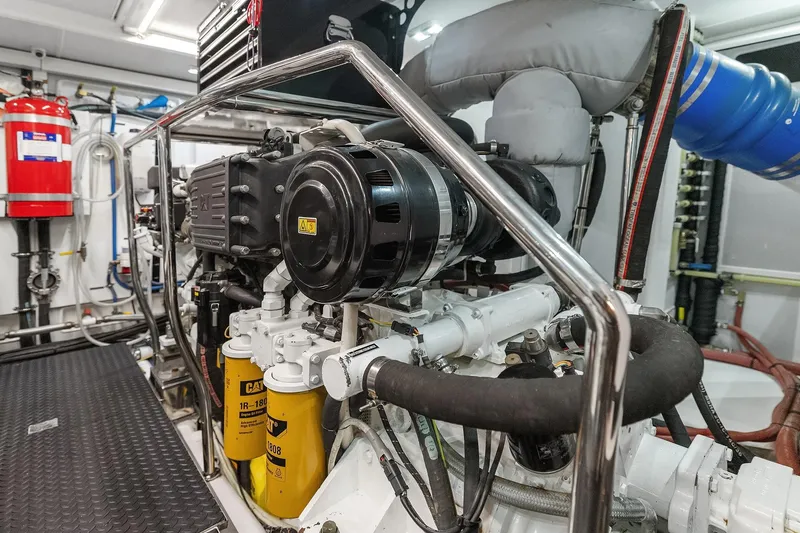 Slide: The Image of Engine room of 2014 Hampton 720 Skylounge LRC yacht, showcasing mechanical components and equipment. - 104