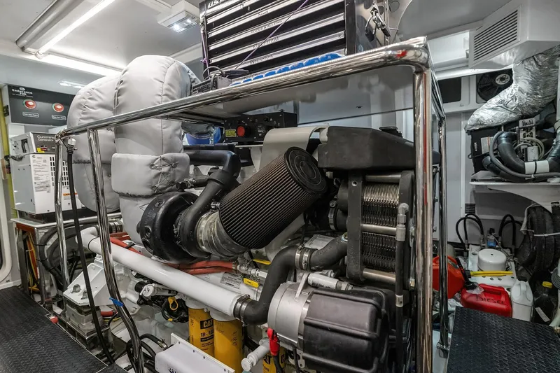 Slide: The Image of 2014 Hampton 720 Skylounge LRC yacht cruising on a scenic lake at sunset. - 107