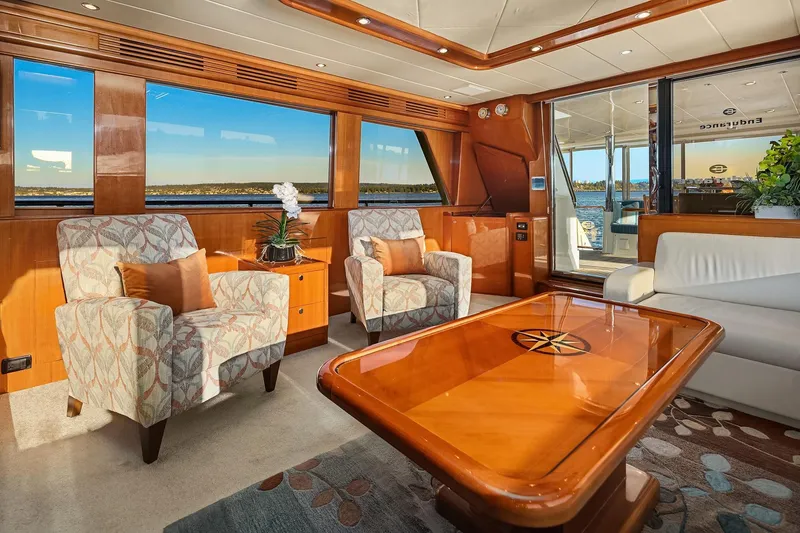 Slide: The Image of Luxurious interior of 2014 Hampton 720 Skylounge LRC yacht with elegant wood finishes and granite countertops. - 11