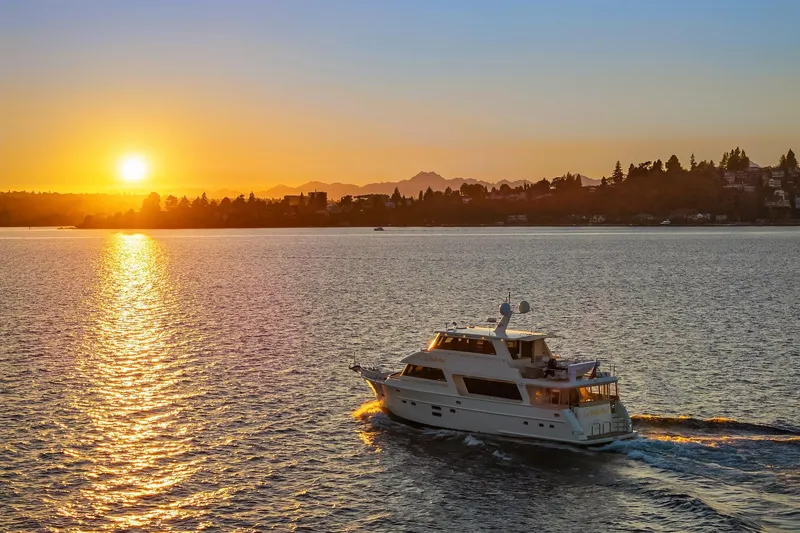 Slide: The Image of Luxurious 2014 Hampton 720 Skylounge LRC yacht cruising on open water. - 119