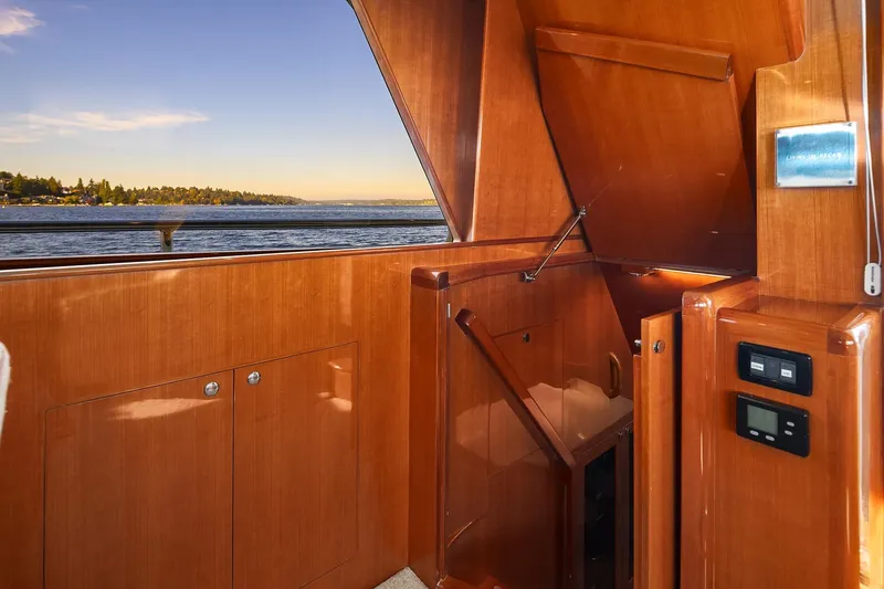 Slide: The Image of Luxurious interior of 2014 Hampton 720 Skylounge LRC yacht with elegant wood and granite finishes. - 12