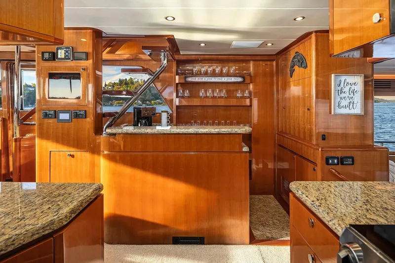 Slide: The Image of Luxurious kitchen interior of 2014 Hampton 720 Skylounge LRC yacht with granite countertops. - 16
