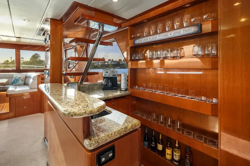 Slide: The Image of Luxurious interior of 2014 Hampton 720 Skylounge LRC yacht with elegant wood finishes and ocean view. - 17