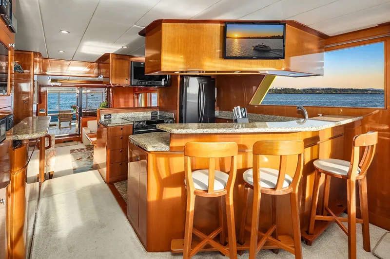 Slide: The Image of Luxurious interior of 2014 Hampton 720 Skylounge LRC yacht with panoramic ocean views. - 24