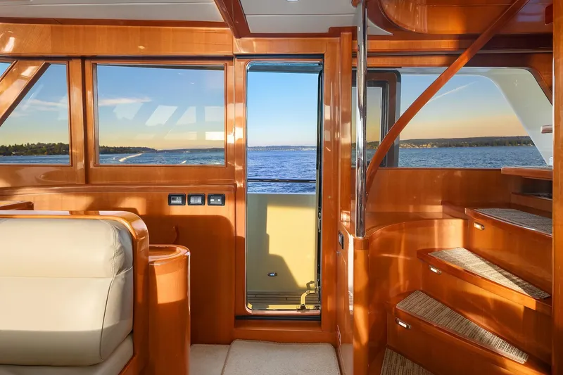 Slide: The Image of Luxurious 2014 Hampton 720 Skylounge LRC yacht interior with navigation equipment and plush seating. - 29
