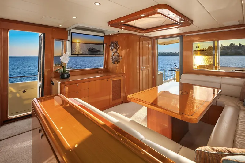 Slide: The Image of Luxurious bedroom interior of 2014 Hampton 720 Skylounge LRC yacht with elegant wood finishes. - 43